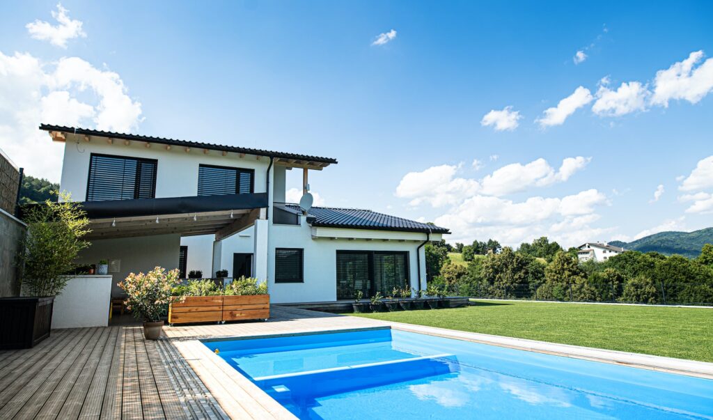 House with swimming pool outdoors in backyard garden